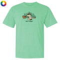 A mint green short-sleeve t-shirt with a cartoon graphic of a 'bark ranger' dog in a hat standing in a pine forest next to a trail sign, shown on a plain white background.