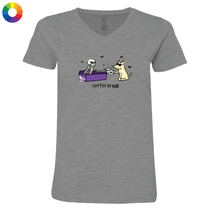 A grey women's V-neck t-shirt featuring a cartoon graphic of a skeleton in a coffin and a dog drinking from a cup, with the text 'coffin break' printed below.