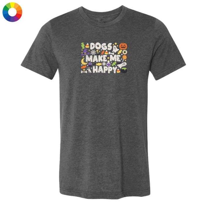 A dark heather gray t-shirt with a colorful graphic on the chest that reads 'DOGS MAKE ME HAPPY' surrounded by Halloween-themed illustrations like pumpkins, ghosts, and a cat. A multicolor color wheel icon is visible in the top-left corner.