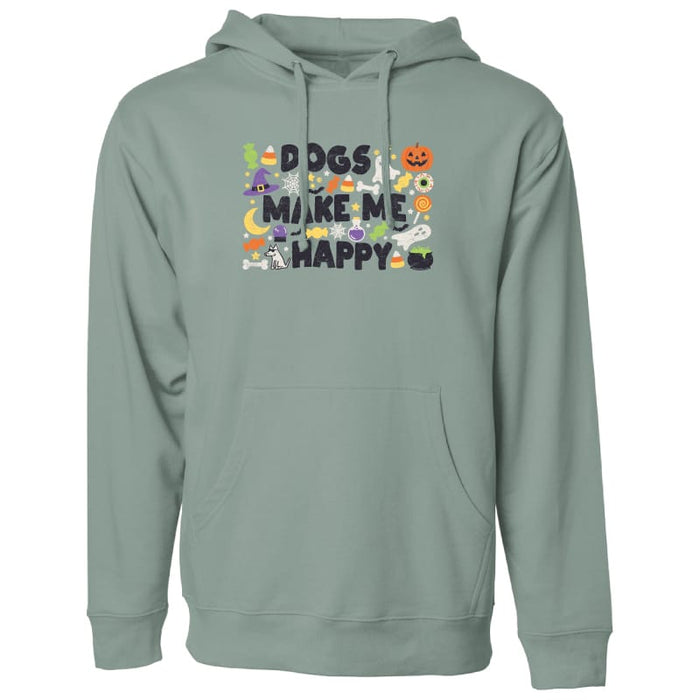 A sage green pullover hoodie with a front graphic that reads 'DOGS MAKE ME HAPPY' in black letters, surrounded by various cute cartoon dogs and Halloween-themed illustrations like a pumpkin, witch hat, and spider. The hoodie is shown against a plain white background.