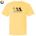 A pale yellow short-sleeve t-shirt with a graphic of three dogs in white, brown, and black, with the text 'untoasted. toasted.