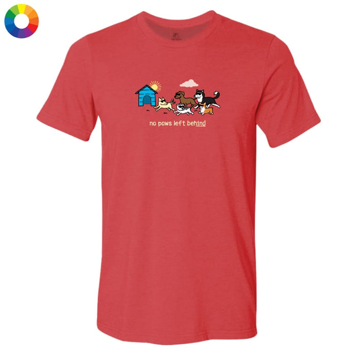 A red short-sleeve crewneck t-shirt with a cartoon graphic of several dogs and a doghouse on the chest, accompanied by the text 'no paws left behind'. The shirt is displayed flat against a white background with a small multicolor color wheel icon in the top-left corner.