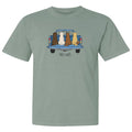 A sage green short-sleeve crewneck t-shirt featuring a graphic of four dogs sitting in the back of a blue pickup truck bed with the text 'TAIL-GATE' printed below.