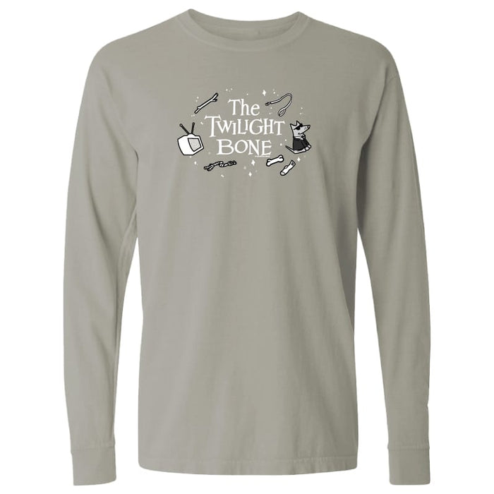 A light gray long-sleeve t-shirt with a black and white graphic on the chest reading 'The Twilight Bone' with cartoon illustrations, shown on a plain white background.